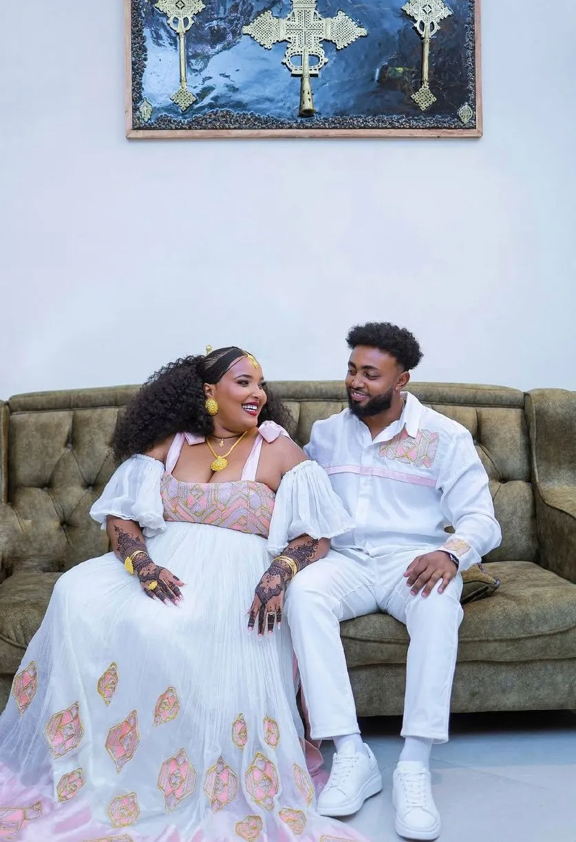 Elegant Light Pink Habesha Couples Outfit with Beautiful Design Ethiopian Couples Outfit